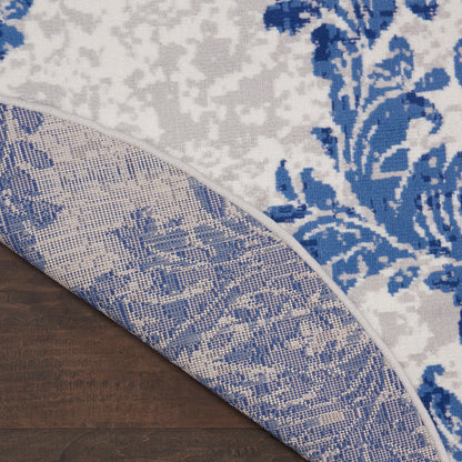 Tapis Nourison Whimsicle style campagne française, motif botanique, ivoire et marine