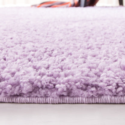 Tapis SAFAVIEH August Wilhelma Shag uni de 3 cm d'épaisseur