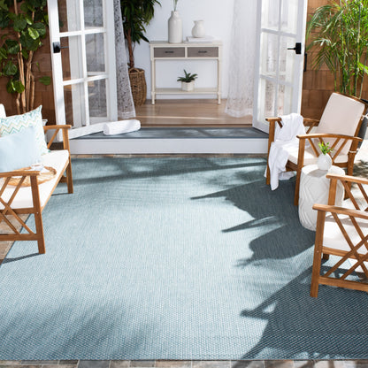 Tapis de patio/jardin imperméable SAFAVIEH Courtyard Begajeta pour intérieur/extérieur.