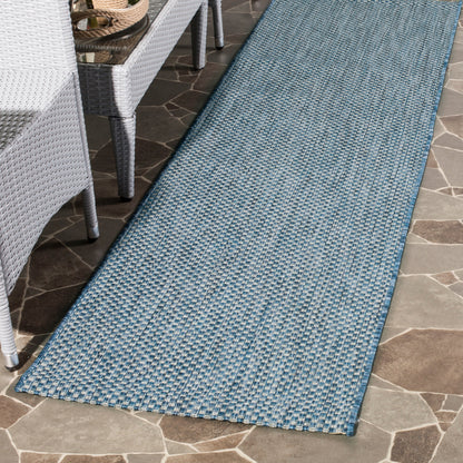 Tapis de patio/jardin imperméable SAFAVIEH Courtyard Begajeta pour intérieur/extérieur.