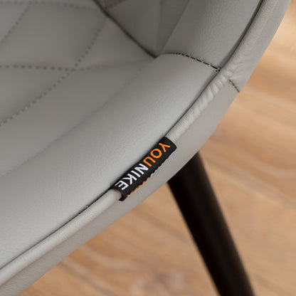 Ensemble de 2 chaises de salle à manger modernes sans accoudoirs, revêtues de cuir.